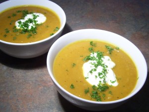 Two bowls of spicy pumpkin soup